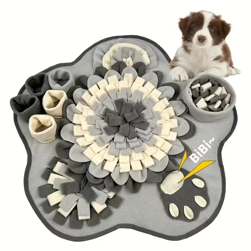 Dog snuffle mat for pets in gray and cream with hiding pockets, puppy sitting beside