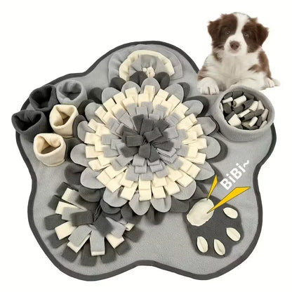 Dog snuffle mat for pets in gray and cream with hiding pockets, puppy sitting beside