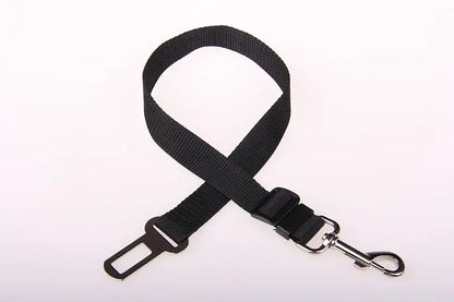 Black adjustable dog seat belt with metal clip for pet car safety on white background