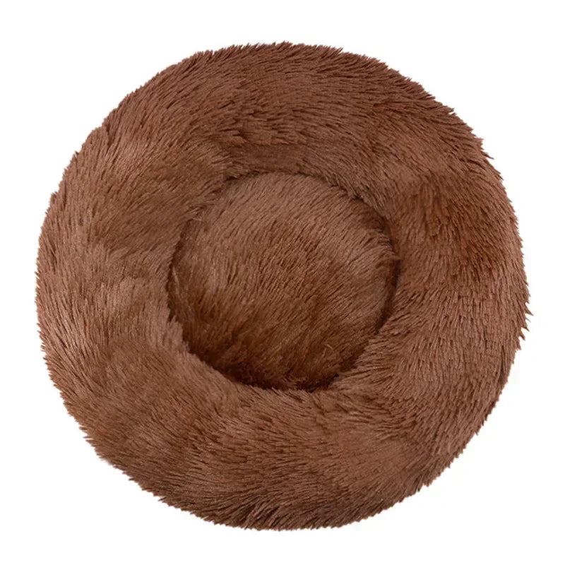 Soft round brown plush pet bed for dogs or cats, cozy and calming design