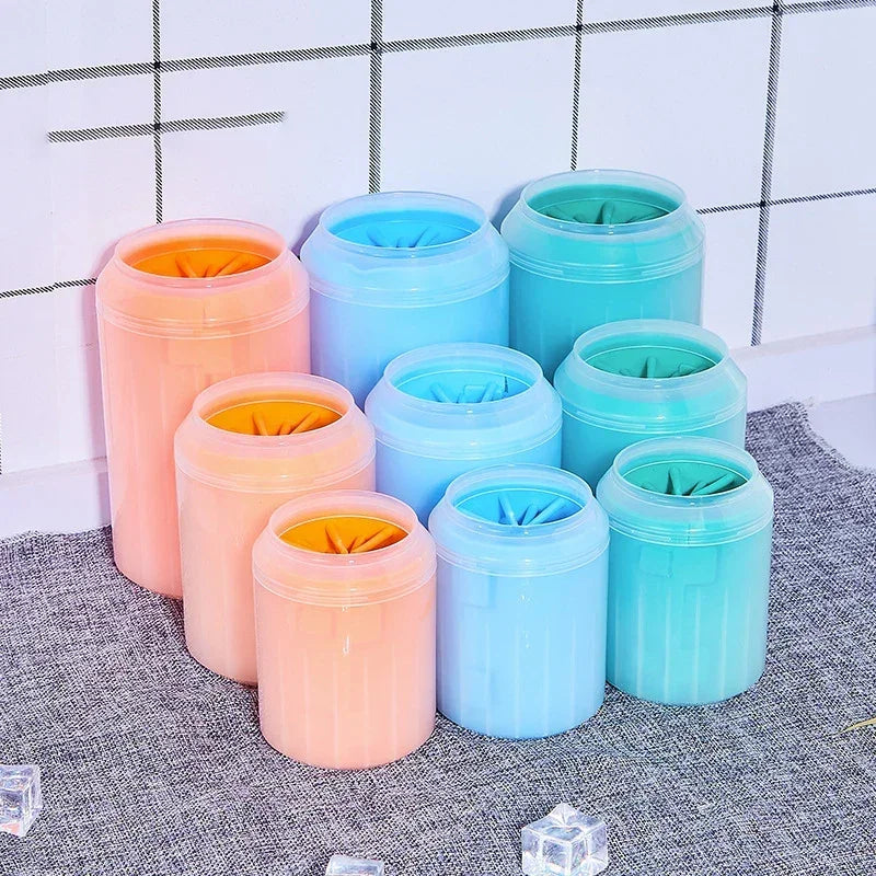 Assorted pastel silicone pet paw cleaners in pink and blue on bathroom counter