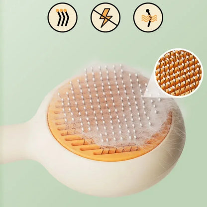 Pet grooming brush with soft bristles for removing loose fur, ideal for dogs and cats.