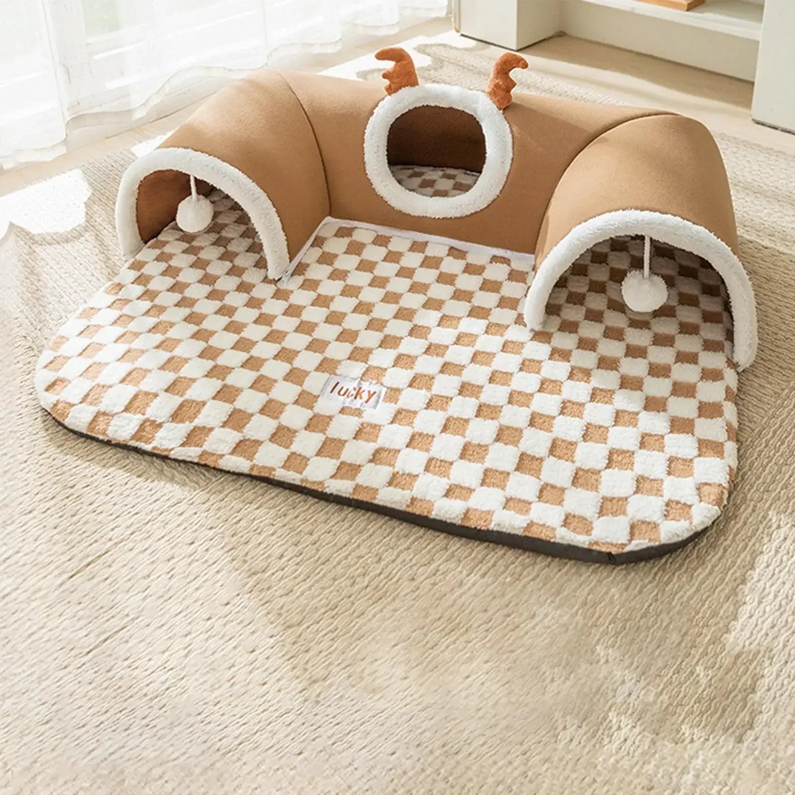 Plush cat tunnel bed with antlers and checkered mat, cozy indoor pet toy