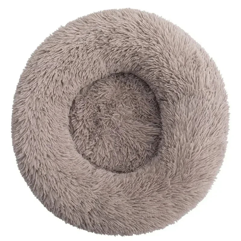 Round fluffy pet bed in light grey, soft plush donut shape for dogs and cats
