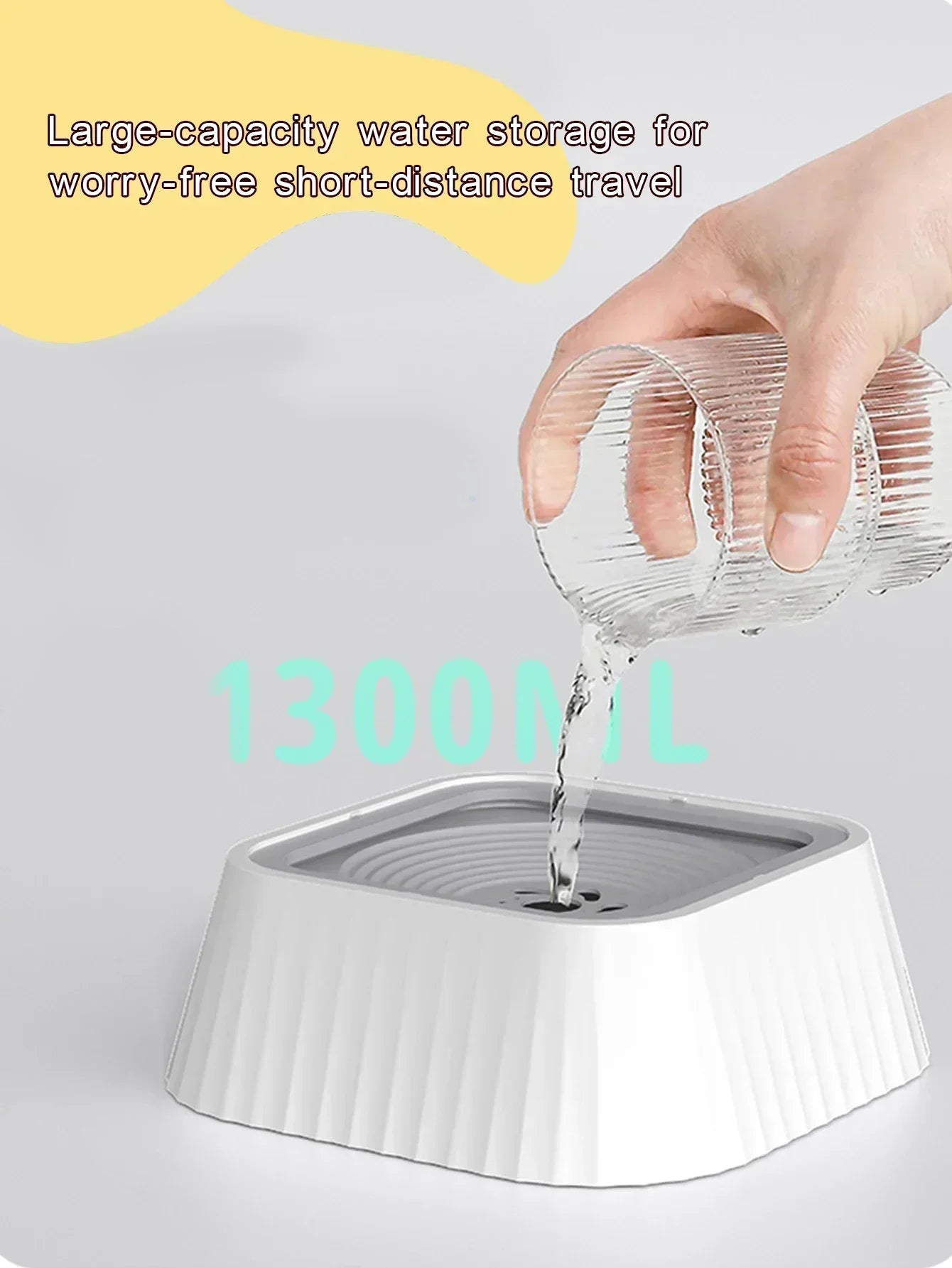 Hand pouring water into a large-capacity 1300ml pet water bowl, ideal for travel.