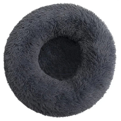 Round fluffy dark gray pet bed with plush raised edges for dogs or cats.