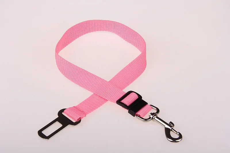 Pink adjustable dog car seat belt safety leash with metal clip and buckle on white background
