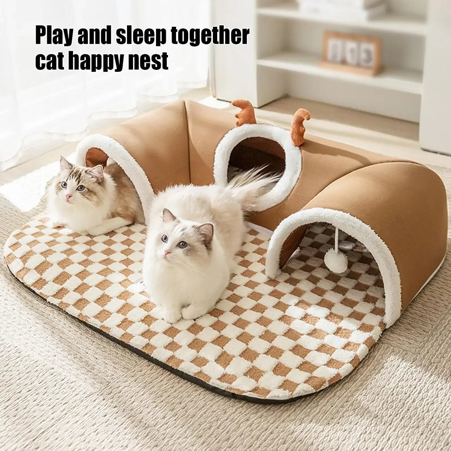 Two fluffy cats on a plush cat tunnel bed with checkered mat in a cozy living room