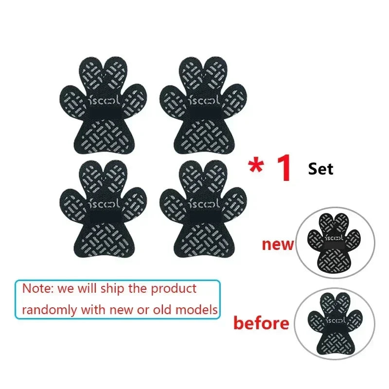 Set of four black paw-shaped pet traction pads with non-slip surface, new and old models shown.