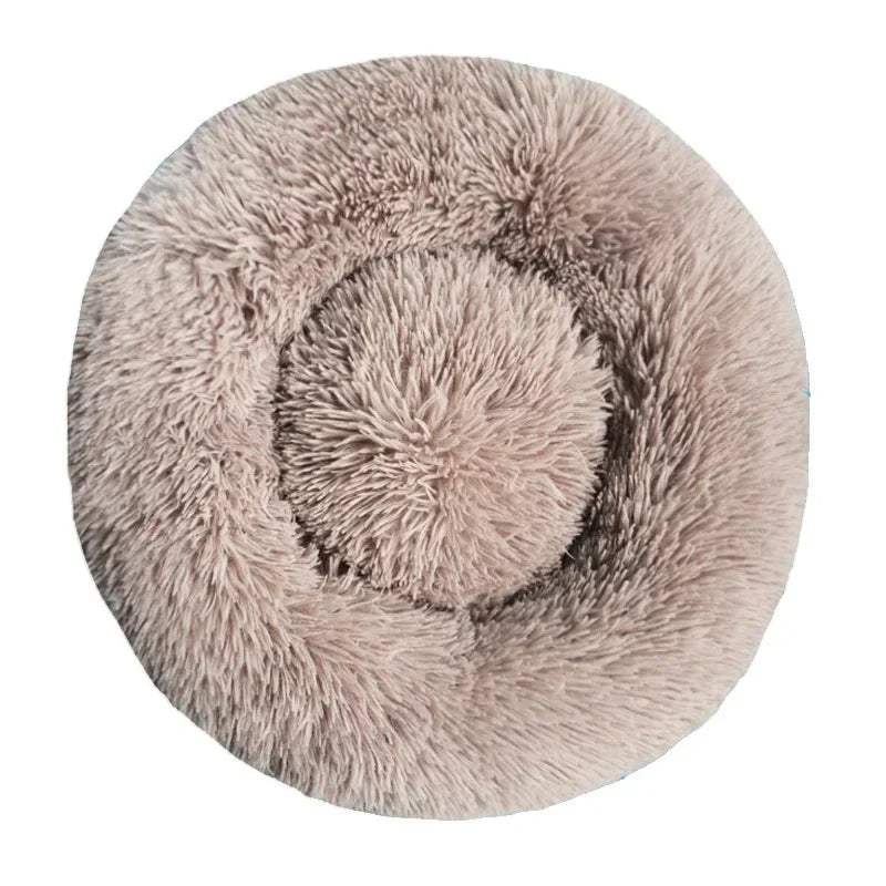 Round fluffy beige pet bed with soft plush texture for dogs or cats