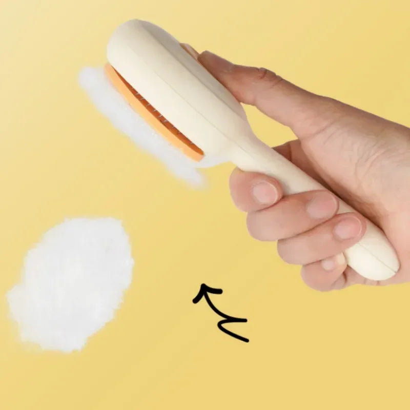 Hand holding a pet grooming brush with removed fur on yellow background