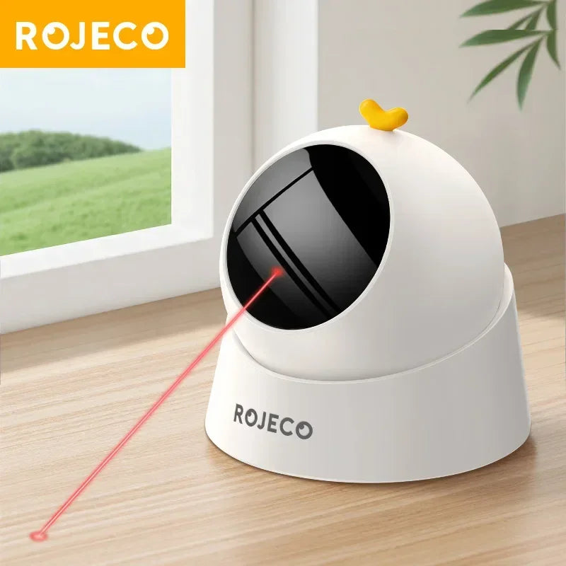 Automatic interactive cat laser toy on wooden table, modern pet entertainment device.